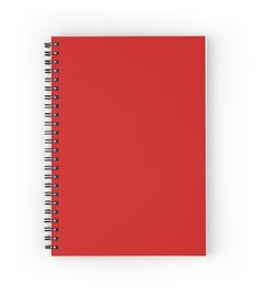 a red spiral notebook on a white background