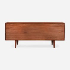 the sideboard is made out of wood and has two legs that are attached to it