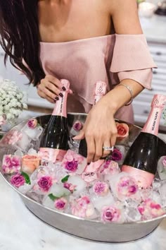 two pictures one is champagne and the other has flowers in ice with straws on them