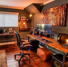 a room with a desk, chair and computer on it