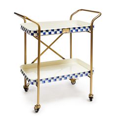 a blue and white checkerboard serving cart with two trays on wheels,