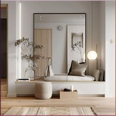 a living room with a couch, mirror and vases on the table in front of it