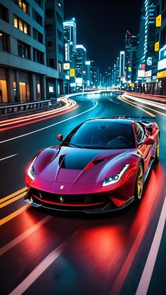 a red sports car driving down a city street at night with buildings in the background