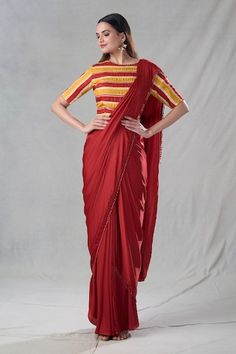 Rust pre-drape saree featuring dangling pipe and bead detailing on the hem. Paired with stripe pattern padded blouse. - Aza Fashions Traditional Saree Blouse Piece With Draped Sleeves, Pre-draped Saree With Draped Sleeves For Festive Occasions, Diwali Festive Saree With Draped Sleeves, Festive Diwali Saree With Draped Sleeves, Festive Saree Blouse Piece With Draped Sleeves, Traditional Pre-draped Saree With Draped Sleeves, Traditional Drape Saree With Draped Sleeves For Diwali, Traditional Draped Blouse With Draped Sleeves, Diwali Saree With Draped Sleeves In Traditional Drape