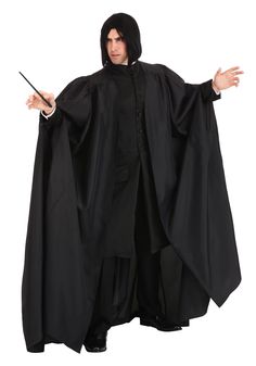 a man in a black robe and hood with his hands out while holding a wand