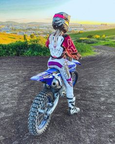 a person riding a dirt bike on a dirt road