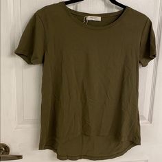 Zara Organic Cotton W&B Tee Khaki Green Color Round Scoop Neck Short Sleeves High Low Hem Tag Pulled Off, But This Is Brand New! Other Than Some Wrinkles This Is In Perfect Condition Size Small Spring Khaki Crew Neck Top, Khaki Crew Neck Tops For Spring, Zara Basic Stretch T-shirt, Zara Stretch Crew Neck T-shirt, Zara Stretch Short Sleeve T-shirt, Zara Stretch T-shirt With Short Sleeves, Everyday Khaki Crew Neck Top, Khaki Short Sleeve T-shirt For Spring, Basic Khaki Short Sleeve Tops