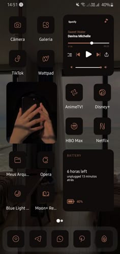 an image of someone holding their phone up to the camera, with other icons above them