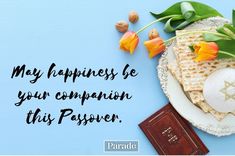 a plate with waffles and flowers on it next to a chocolate bar that says, may happiness be your companion this passover