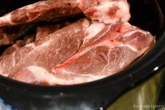 raw meat in a slow cooker ready to be cooked