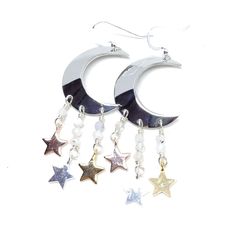 You were born with the imprint of the moon and stars on your soul. Show your ties to the ethereal night sky with these sparkling moon and star earrings! These earrings dangle 2 3/4". Sterling silver ear wires, rhodium plated moons, moonstones. To keep these moon and stars bright and shiny, I recommend a Sunshine Polishing Cloth! Celestial Moon Charm Crystal Earrings, Silver Celestial Crystal Earrings, Silver Celestial Crystal Earrings As Gift, Celestial Silver Pierced Crystal Earrings, Silver Celestial Crystal Earrings For Gift, Silver Celestial Crystal Earrings For Pierced Ears, Nickel-free Celestial Crystal Earrings, Mystical Silver Drop Earrings, Silver Crescent Crystal Earrings For Pierced Ears