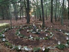 a circle made out of rocks in the woods