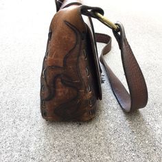 "Beautiful Vintage 60s or 70s Saddle Leather Handbag Purse Great Vintage Condition with Amazing Patina - unique hardware, and leather stitching, inside leather pocket Rough Measurements: Width: 10 1/2\" Length (the bag itself not including strap or ring handles): 9\" Depth (slightly Stretched): 4\" Will ship out between 1-3 business days once the payment has been made. Please message me w/ any questions. All sales final. And please check out my other vintage shirts!! thank you!" Unique Hardware, Leather Stitching, Leather Pocket, Brown Shirt, Ring Handle, James Brown, Saddle Leather, Rock Shirts, Fleetwood Mac