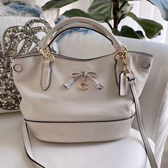 So Cute Coach Authentic Leather Mini Bag Off White! Great Condition Only Marking In Bottom Of Bag See Photos Brand New Interior! Classic Style Never Goes Out Love The Size! Small Tiny Shadow Spot On Bottom Front Very Faint. See All Photos Top W 12” H 7” Bottom W 9” Chic Cream Satchel With Branded Hardware, Coach Cream Satchel Bag, Coach White Satchel With Branded Hardware, Coach Cream Satchel With Double Handle, White Coach Bag With Removable Pouch, White Coach Satchel For On-the-go, Cream Coach Shoulder Bag With Zipper Closure, Mini Tote, Cream White