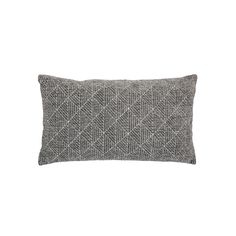 a black and white pillow on a white background