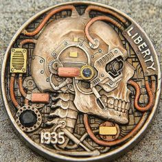 there is a metal coin with a skull on it