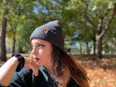 Give the gift of warmth and style! This knit beanie is perfect for hiking, camping, and perfect for keeping warm! Beanie is a dark charcoal gray color, and is made of a soft wool/acrylic blend. Attached is an engraved leather label tag with a brass rivet. The leather label is engraved on both sides, so whether you wear the hat with the brim up or down, the label will still show the design in the correct orientation. Choice of circle logo or trees available at checkout. Care - Hand wash, dry flat Warm Beanie For Outdoor, Warm Outdoor Hat One Size, Adjustable Beanie For Cold Weather In Fall, Adjustable Warm Beanie For Outdoor, Warm Adjustable Beanie For Outdoor, Warm Beanie For Fall And Winter, Casual Knitted Hats For Outdoor Activities, Warm Winter Beanie For Fall, Adjustable Winter Beanie For Outdoor Activities