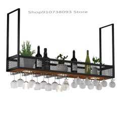 a metal rack with wine bottles and glasses hanging from it