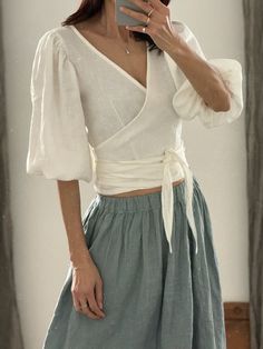 "* 100% washed linen  * 3/4 puff sleeve * The belt is attached to the blouse * Handmade in Slovakia Measurements in cm/inches:  --------------------------- Size XS / US size (4) Recommended body measurements in cm/inches: Bust: 81cm/32\" - 84 cm/33\" Waist: 65 cm/25,5\" - 68 cm/27\" Hips: 84 cm/33\" - 87 cm/34\" Length (from the neckline to the hem, measured from the back - total length): 58 cm/ 23\" --------------------------- Size S / US size (6) Recommended body measurements in cm/inches: Bust: 85/33,5\" -88/34,5\" Waist: 69/27\" - 72/28,5\" Hips: 88/34,5\" - 91/36\" Length (from the neckline to the hem, measured from the back): 58 cm/23\" --------------------------- Size S/M / US size (8) Recommended body measurements in cm/inches: Bust: 89/35\" - 92/36\" Waist: 73/28\" - 75/29,5\" Hip Fitted Linen Blouse For Brunch, Linen Puff Sleeve Top For Brunch, Fitted Linen V-neck Wrap Top, Bohemian Linen Blouse For Brunch, Spring Fitted Linen Wrap Top, Fitted Linen Wrap Top For Spring, Fitted Linen Wrap Top, Summer Linen Blouse With Puff Sleeves, Fitted Linen Wrap Blouse