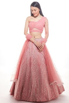 Featuring a baby pink lehenga in organza base with floral geometric embroidered fine beads pattern. It is paired with a matching ruched one-shoulder blouse and a net dupatta.    FIT: Fitted at bust and waist.  COMPOSITION: Organza, Net.  CARE: Dry clean only. Net Dresses Western, Pink Organza Lehenga, Saree Wearing Styles, Desi Outfits, Organza Lehenga, Lehenga Blouse Designs, Dresses Design, Desi Fashion Casual, Net Dress