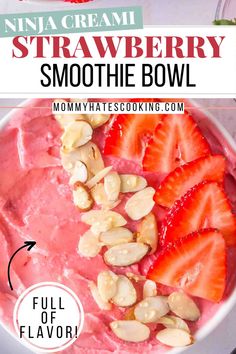 strawberry smoothie bowl with strawberries and almonds in it, on top of a white plate