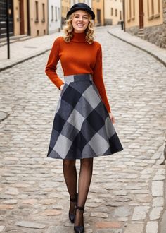 Embrace a bold, modern look with this A-line midi skirt featuring a striking black and grey geometric pattern. Its high-waisted design and flared silhouette offer an elegant, feminine shape, perfect for any occasion. ★★ FEATURES * 30% wool, 30% fiber, 40% polyester * Polyester lining * Two side seam pockets * Right zipper closure * back little elastic band * Plus size full skirt * A Line Skirt * Perfect for Winter, autumn * Dry clean ★★ The model is 170 cm (5′ 7″) tall with a 80 cm (31.5") bust, 66 cm (26") waist. She is wearing the wool plaid skirt in size XS. ★★ Bespoke Order Service If you Request other color Request the length Your height is not between 155 cm- 172 cm Your weight is over 75 kg I can do it for you, It will need some extra fee depending on on your need. Contact with me f A Line Skirt Winter Outfit, Elegant Plaid Winter Skirt, Plaid Pencil Skirt Outfit, Retro A-line Winter Skirt, Chic A-line Wool Skirt, Full Skirt Outfit, Retro Full Plaid Skirt, Winter Skirts, Retro Plaid Knee-length Skirt