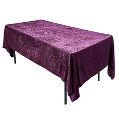 a purple table cloth with black metal legs