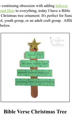 a christmas tree made out of green paper with words on it and a gold star