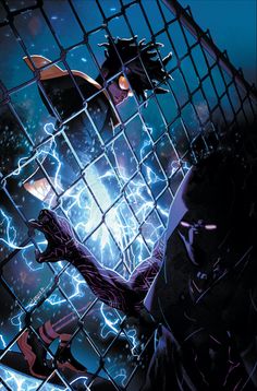 batman and catwoman in caged area with blue light coming from behind the cage