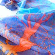 Silk scarf Orange Tree in Blue is a hand painted scarves made of pure Habotai silk and painted with fiery tree silhouette on deep blue sky. This scarf isa lovely graduation gift. It is made to order and I will need up to 3 days for painting. The Fiery Trees symbolize strength and knowledge. I designed this scarf with strong opposite color set: red - orange - yellow with cool blue background creating a contrast scarf, an eye-chatcher and a perfect statement piece of wearable art. This scarf is ap Blue Hand Painted Silk Scarf, Artistic Hand Dyed Blue Silk Scarf, Artistic Blue Silk Scarves, Artistic Blue Silk Scarf, Artsy Blue Silk Scarf As Gift, Artsy Blue Silk Scarf Gift, Artsy Blue Scarf As Gift, Artsy Blue Scarf As A Gift, Artsy Blue Scarf For Gift