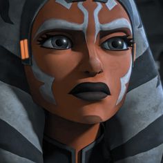 an animated image of a woman wearing a star wars outfit and looking at the camera