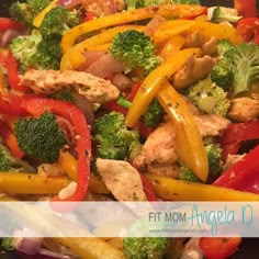 a close up of a plate of food with broccoli, peppers and chicken