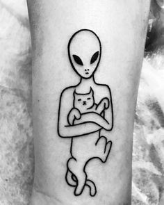 an alien holding a cat on the arm