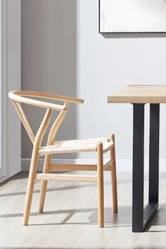 two chairs sitting next to each other near a table