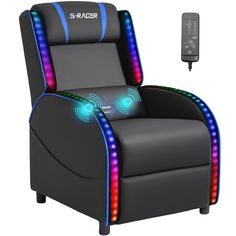 a black chair with blue and red lights on it next to a tv remote control