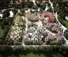 an aerial view of a large building with many rows of windows and trees around it