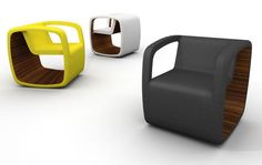 three different colored chairs sitting next to each other on a white surface and one is black, the other is yellow