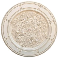 a white plate with an intricate design on the top and bottom, isolated against a white background