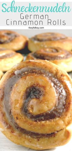 german cinnamon rolls are stacked on top of each other with chocolate sauce in the middle