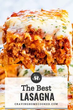 the best lasagna casserole recipe with cheese and meat in it is being held up by a spatula