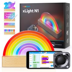 an electronic device with a rainbow light next to it's packaging and instructions for the project