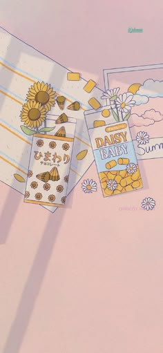 there are two baby shower cards on the table with sunflowers and daisies