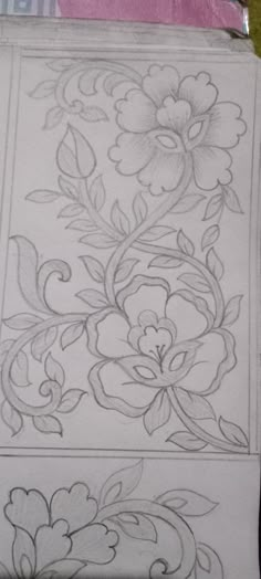 two drawings of flowers and leaves on paper