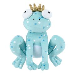 a stuffed frog with a crown on it's head and eyes, sitting in front of a white background