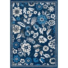 a blue and white rug with flowers on it