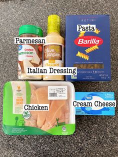 three packaged food items sitting on top of a granite floor next to boxes of pasta