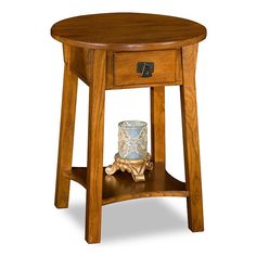 a small wooden table with a vase on the bottom and one drawer open to show an item