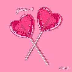 two heart shaped lollipops with the words yum on them against a pink background