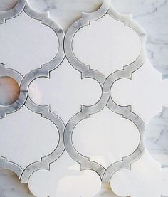 a marble wall with an intricate design on it