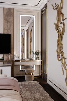 a bedroom with a large mirror, vanity and television on the wall in front of it